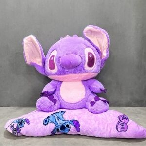 large purple Stitch plush toy and accompanying pillow